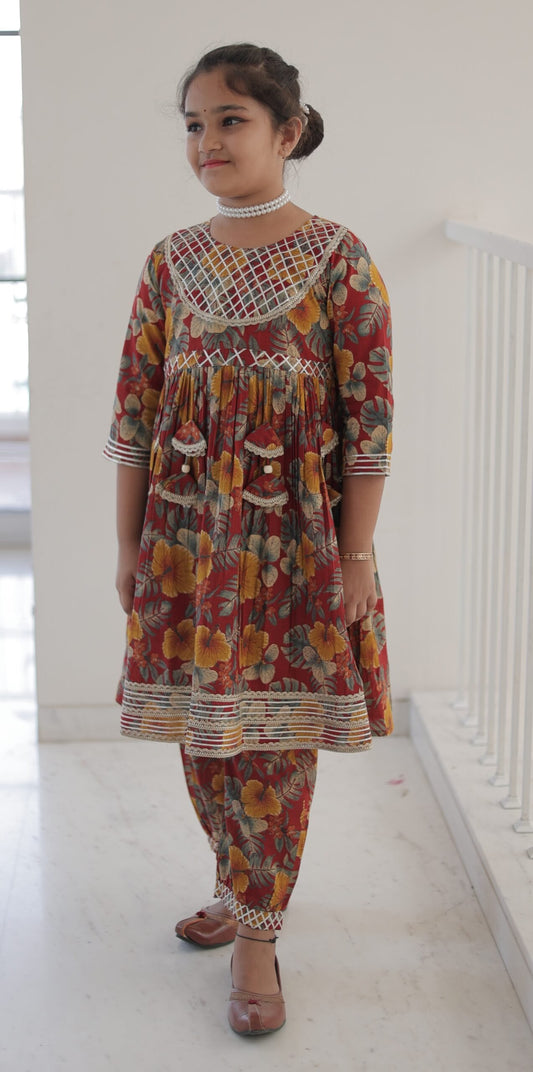 Girls’ Maroon Floral Printed Kurta & Dhoti Pant Set with Tassels and Net Yoke